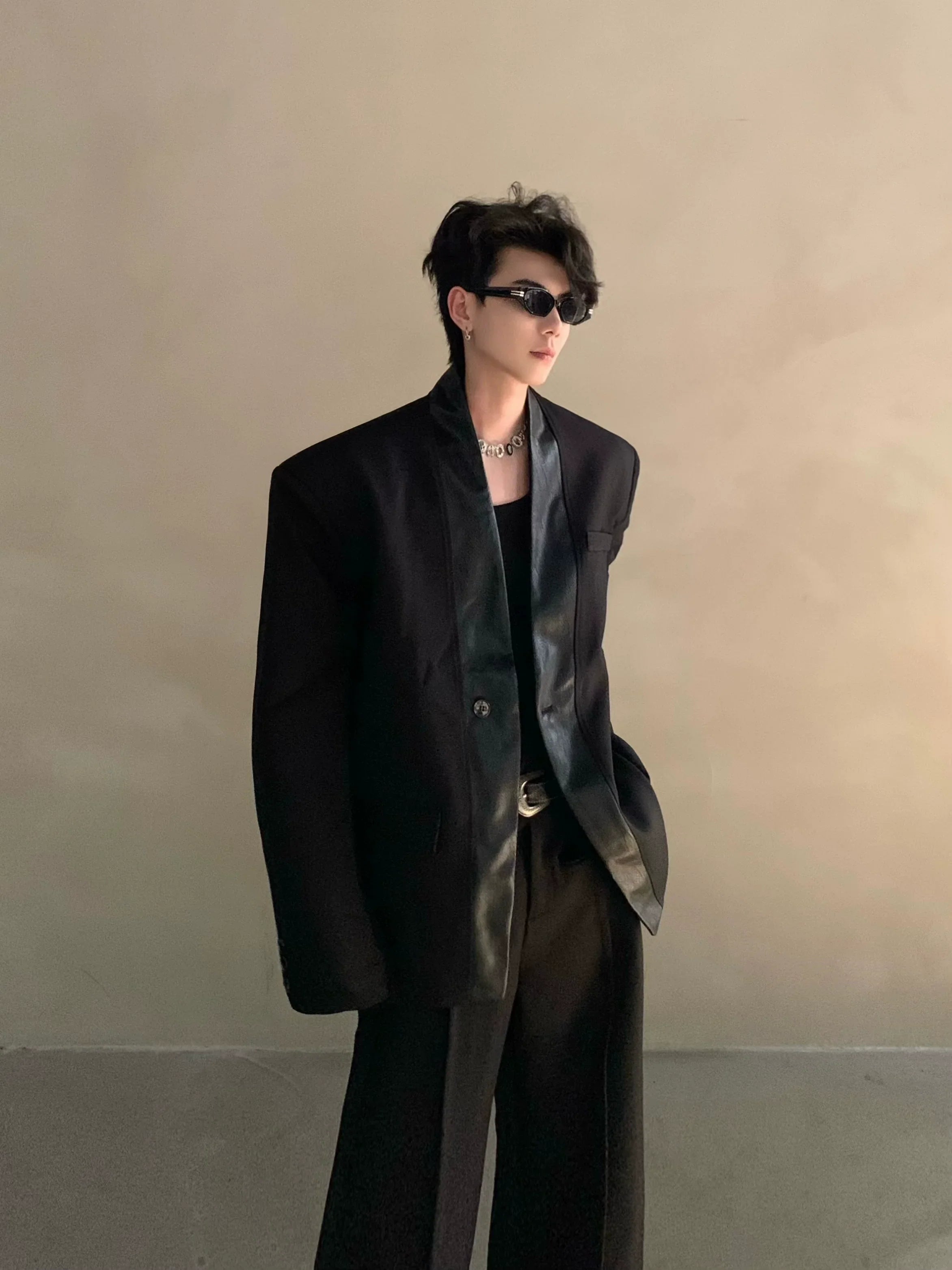 Autumn and winter black collarless suit splicing leather jacket profile shoulder pads light luxury ruffian handsome high-end jacket FE0584